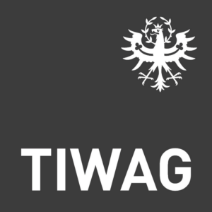 Weißes Logo der TIWAG mit dem Tiroler Adler auf dunklem Hintergrund